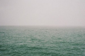 hans_isaacson--a_large_body_of_water_sitting_under_a_cloudy_sky--unsplash.jpg