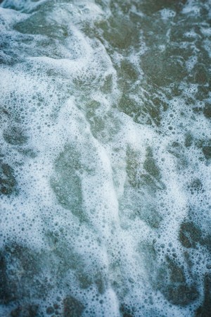 josh_a._d.--a_close_up_of_a_surfboard_in_the_water--unsplash.jpg
