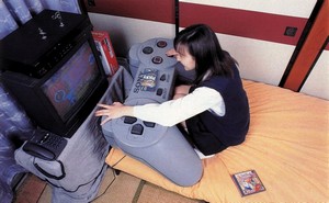small_woman_large_playstation.jpg